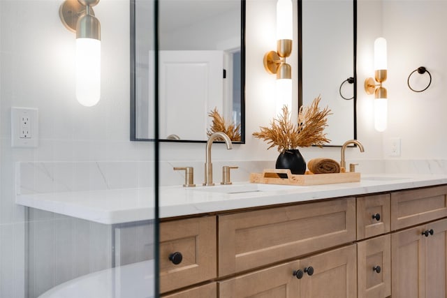 bathroom featuring double vanity and a sink