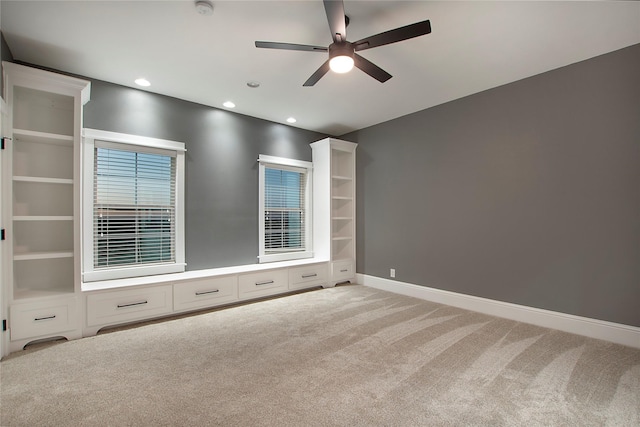 empty room with light carpet, baseboards, ceiling fan, and recessed lighting