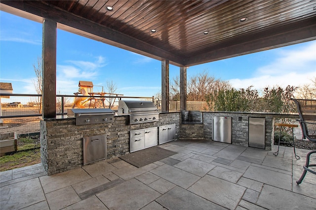 view of patio / terrace featuring exterior kitchen and area for grilling