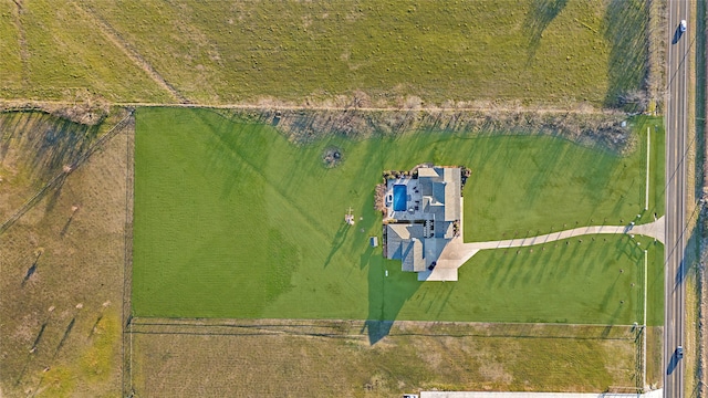 birds eye view of property featuring a rural view