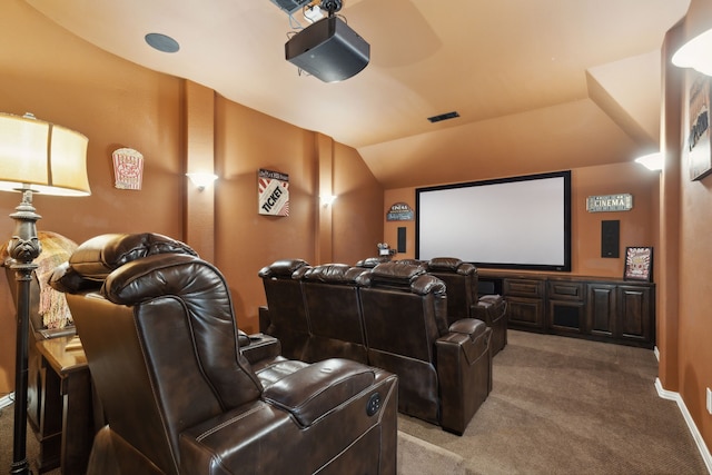 cinema featuring vaulted ceiling, carpet floors, visible vents, and baseboards