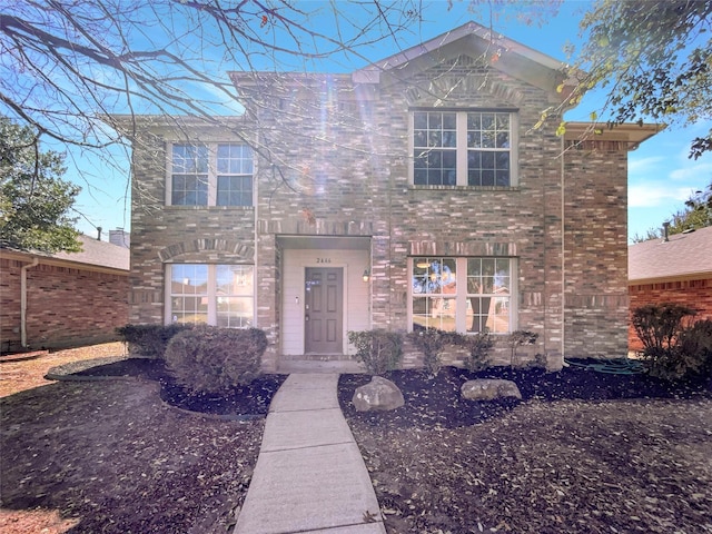 view of front of home featuring brick siding