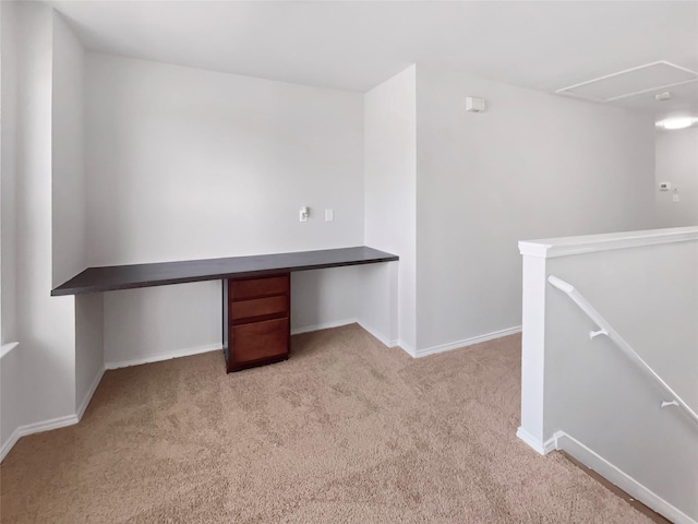 unfurnished office featuring carpet floors and baseboards