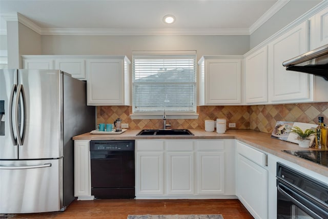 kitchen with black appliances, white cabinetry, light countertops, and a sink