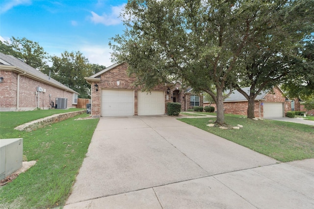 view of front of home featuring a garage, central AC, brick siding, driveway, and a front yard