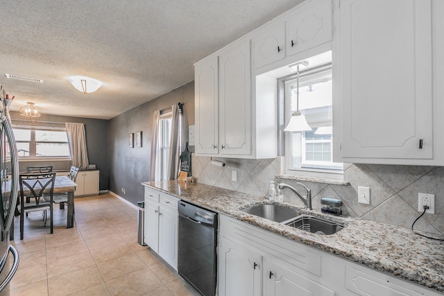 kitchen with dishwasher, a sink, and white cabinets