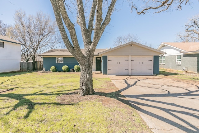 single story home featuring a front yard, concrete driveway, fence, and an attached garage