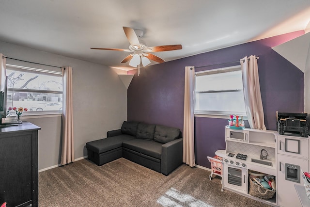 living room featuring a healthy amount of sunlight, baseboards, and carpet flooring