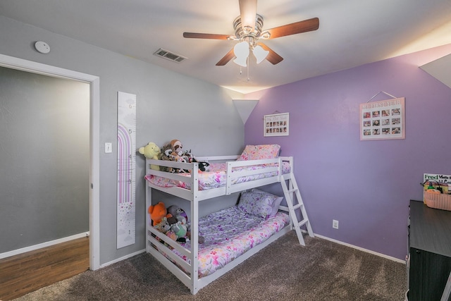 bedroom featuring carpet floors, baseboards, visible vents, and a ceiling fan