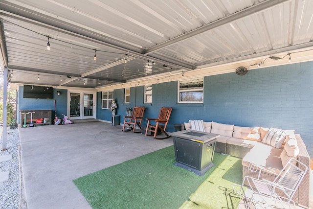 view of patio / terrace featuring an outdoor living space with a fire pit