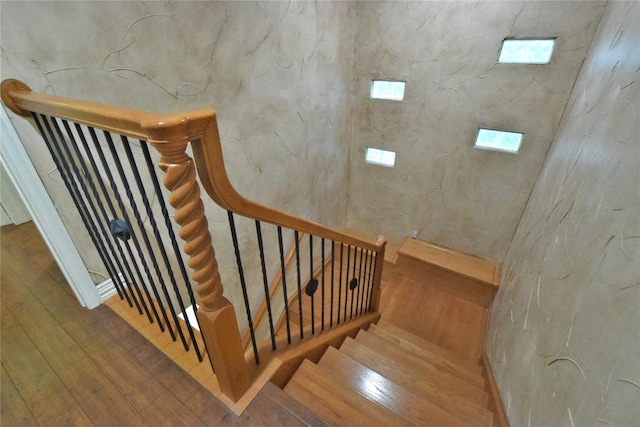 stairs with wood-type flooring