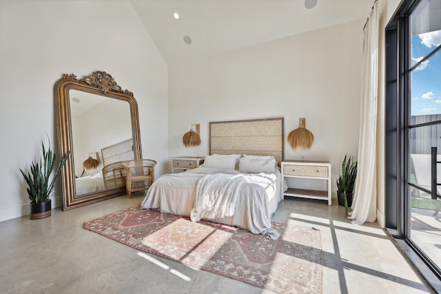 bedroom with high vaulted ceiling, access to outside, baseboards, and concrete flooring