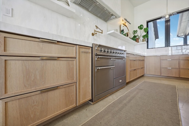 kitchen with light brown cabinets, premium range hood, light countertops, double oven range, and concrete floors