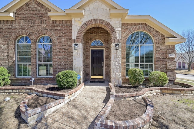 entrance to property with brick siding