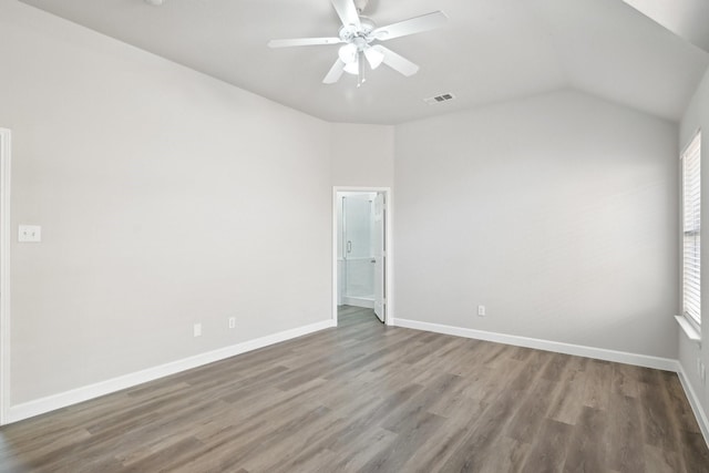 unfurnished room featuring visible vents, baseboards, and wood finished floors