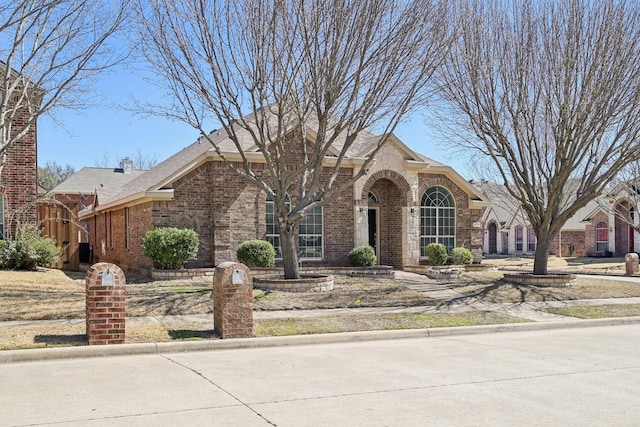 view of front facade featuring brick siding