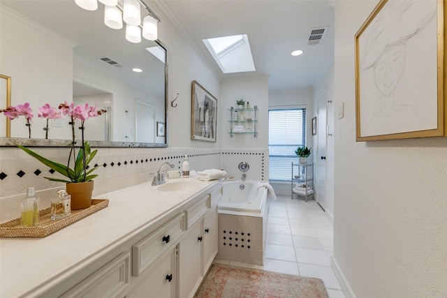 bathroom with a skylight, visible vents, and ornamental molding