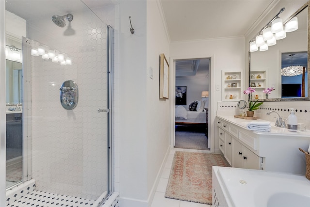 ensuite bathroom with crown molding, vanity, a shower stall, ensuite bath, and tile patterned floors