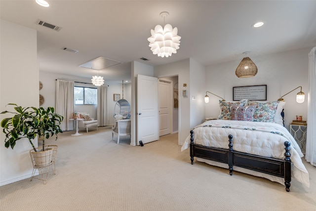 bedroom with carpet floors, attic access, visible vents, and recessed lighting