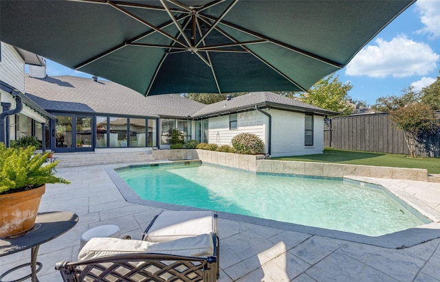 view of pool featuring a fenced in pool, a patio area, and fence