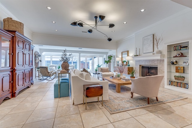 living area with ornamental molding, a tile fireplace, light tile patterned flooring, and recessed lighting