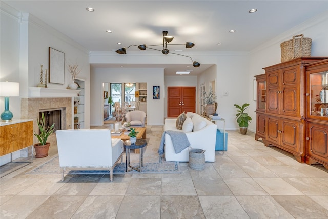 living room with ornamental molding, a high end fireplace, baseboards, and recessed lighting