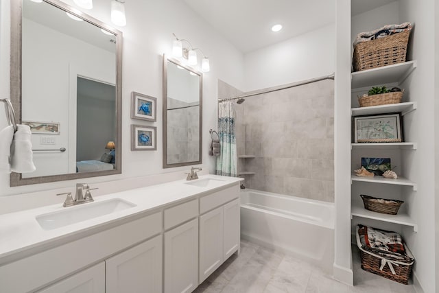 full bath featuring shower / bath combination with curtain, double vanity, ensuite bath, and a sink