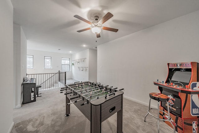 recreation room featuring baseboards and carpet flooring