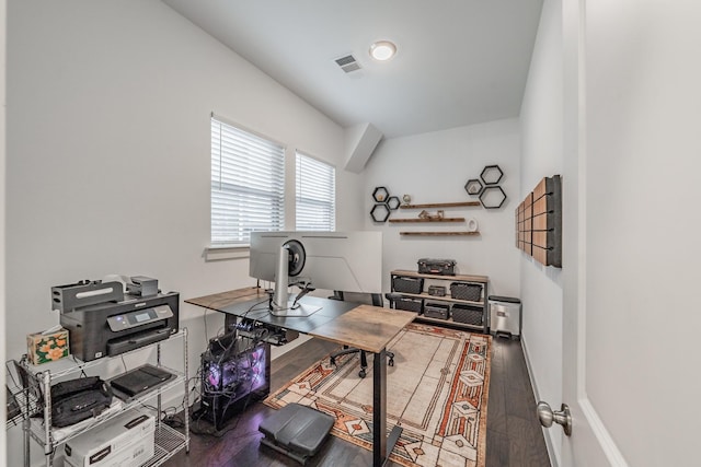 office with baseboards, visible vents, and wood finished floors