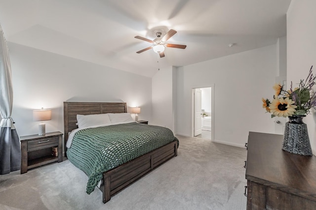 carpeted bedroom featuring ceiling fan, lofted ceiling, and baseboards