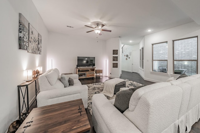 living area with recessed lighting, a ceiling fan, baseboards, visible vents, and dark wood-style floors