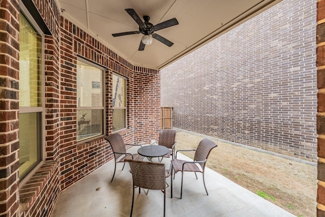 view of patio / terrace with ceiling fan and outdoor dining space