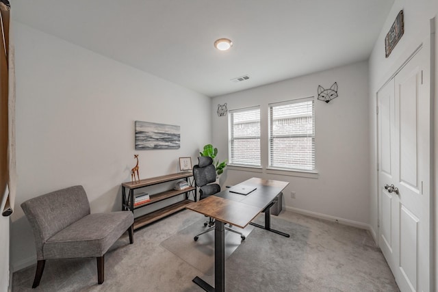 office with carpet floors, baseboards, and visible vents