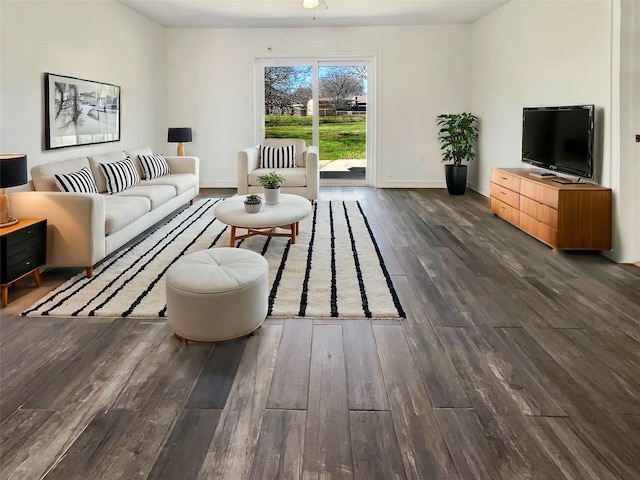 living area with wood finished floors and baseboards