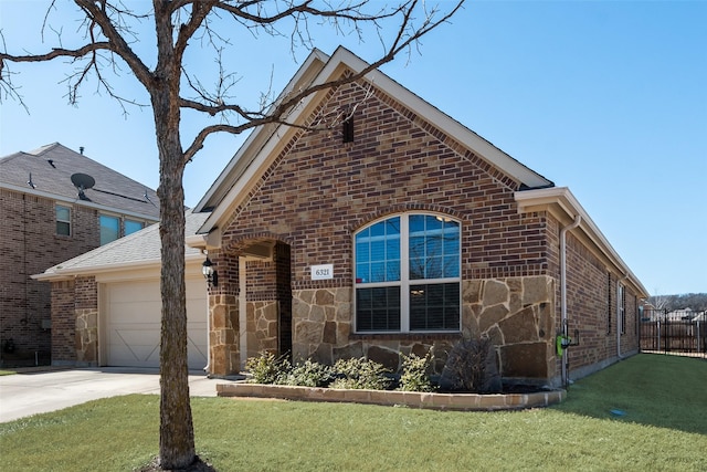 view of front facade with driveway, stone siding, an attached garage, a front lawn, and brick siding