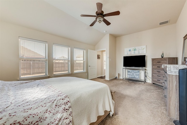 bedroom featuring light carpet, ceiling fan, vaulted ceiling, and visible vents