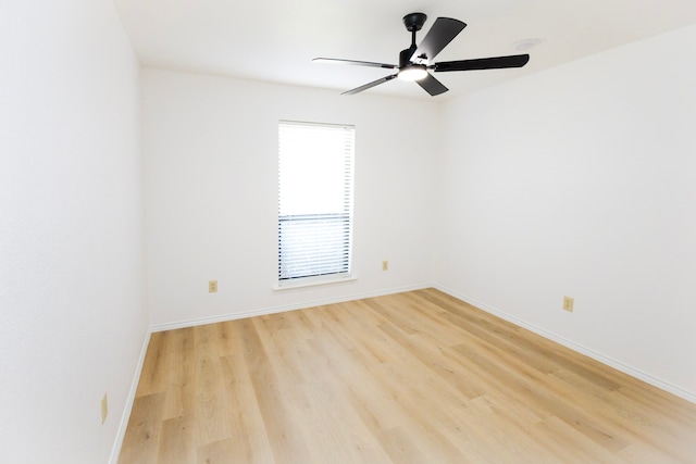 unfurnished room featuring light wood-style floors, baseboards, and a ceiling fan