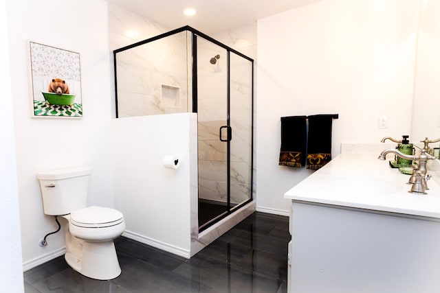 full bathroom with double vanity, baseboards, toilet, a shower stall, and a sink