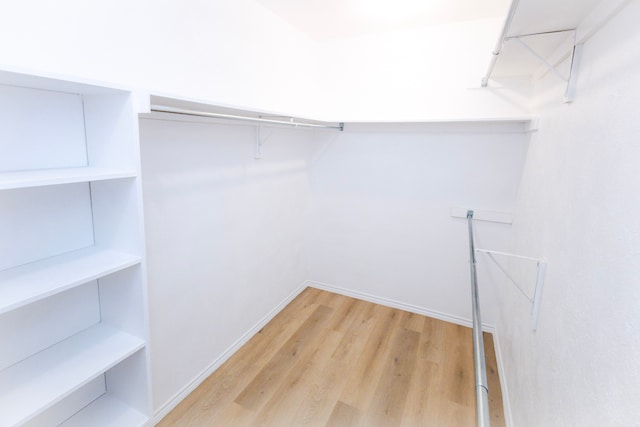 spacious closet with wood finished floors