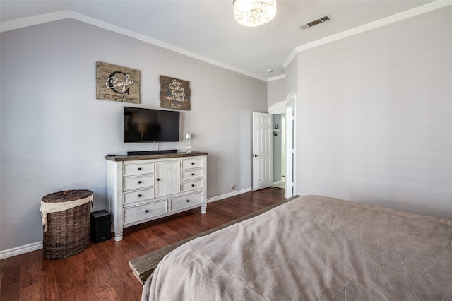 bedroom featuring arched walkways, visible vents, ornamental molding, wood finished floors, and baseboards