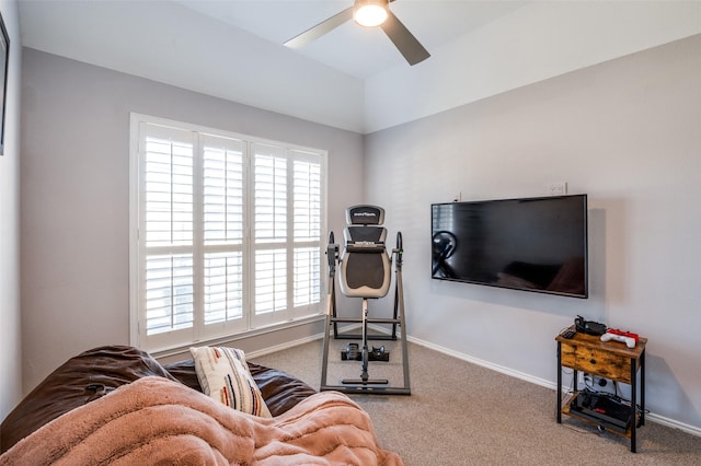 workout room with carpet flooring, ceiling fan, and baseboards