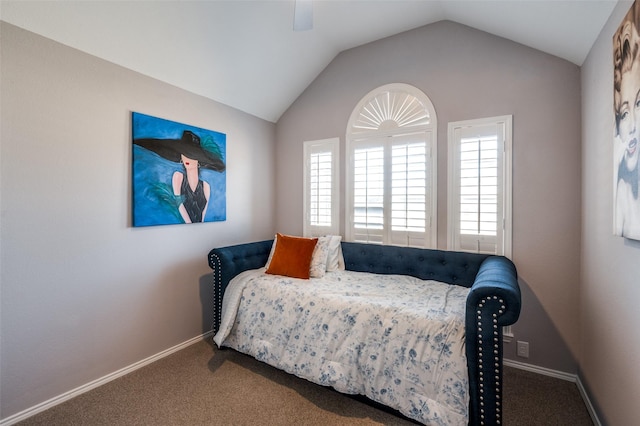 carpeted bedroom with lofted ceiling, a ceiling fan, and baseboards