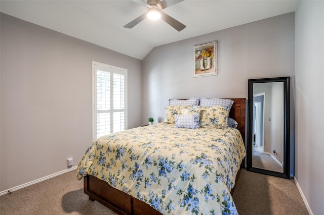 carpeted bedroom with lofted ceiling, ceiling fan, and baseboards