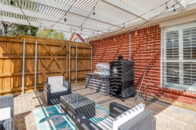 view of patio with fence and a pergola