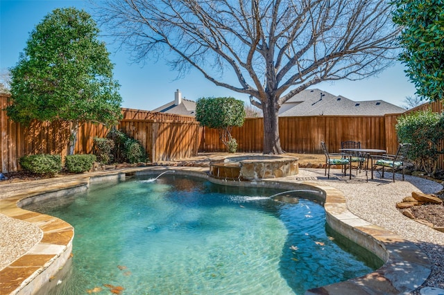 view of pool with an in ground hot tub, a patio area, a fenced backyard, and a fenced in pool