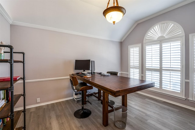 home office with ornamental molding, lofted ceiling, baseboards, and wood finished floors