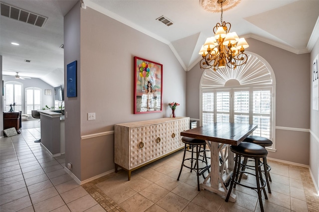 dining room with baseboards, visible vents, and vaulted ceiling