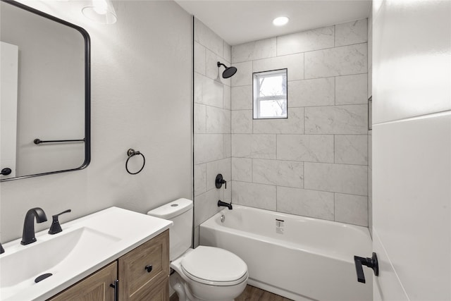 full bathroom with shower / tub combination, vanity, and toilet