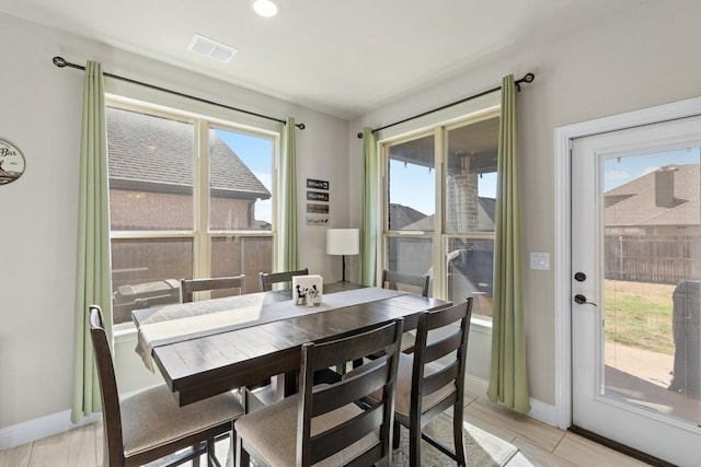 dining area with baseboards and visible vents