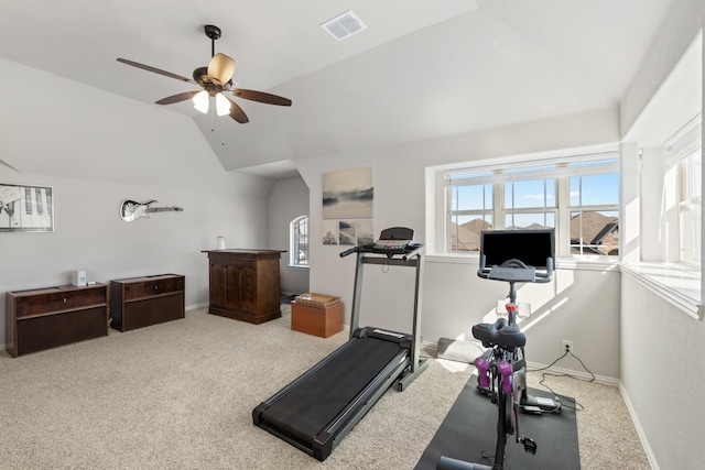 workout room with lofted ceiling, carpet flooring, visible vents, and baseboards